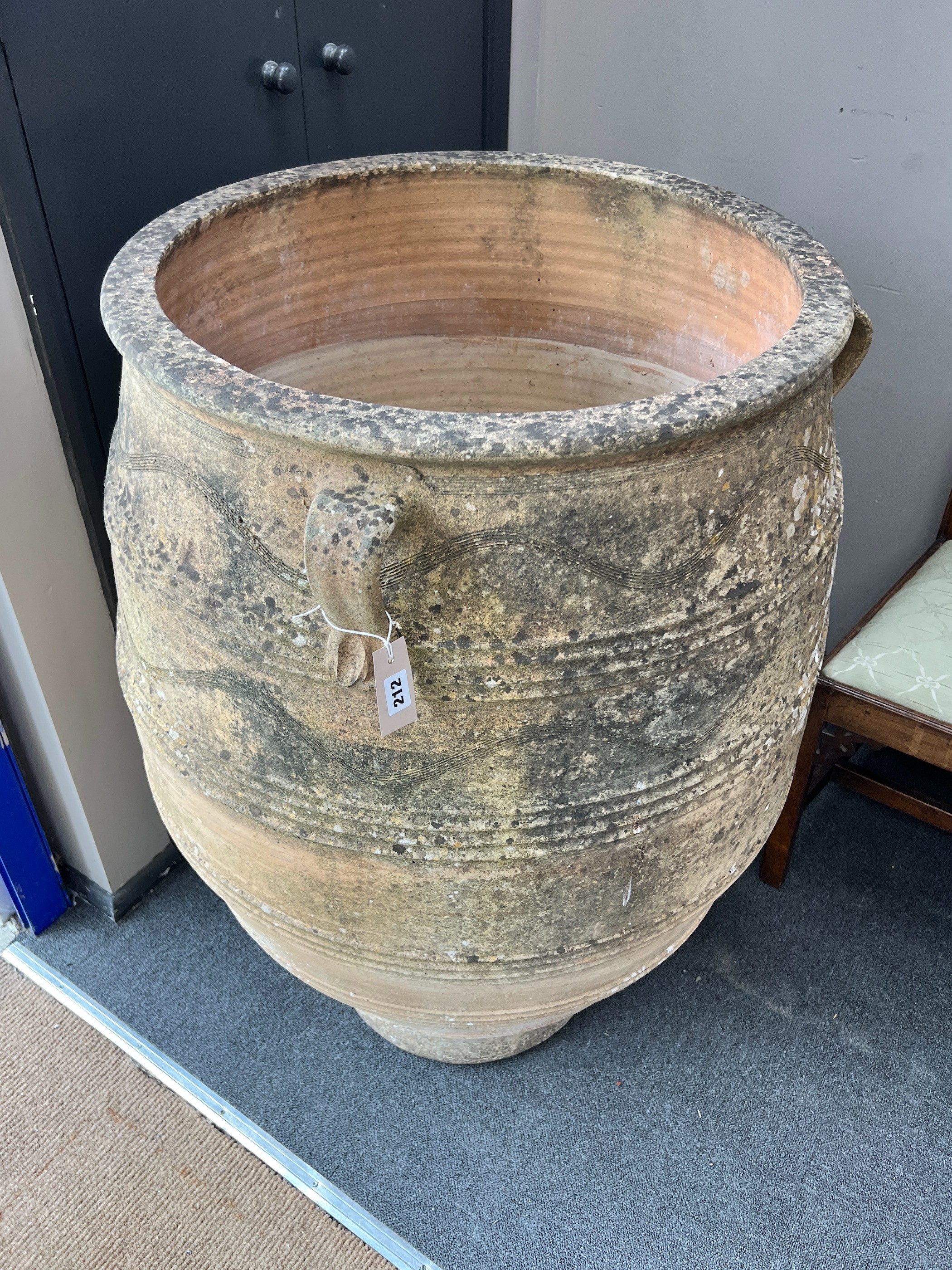 A large Grecian style incised terracotta oil jar, height 105cm